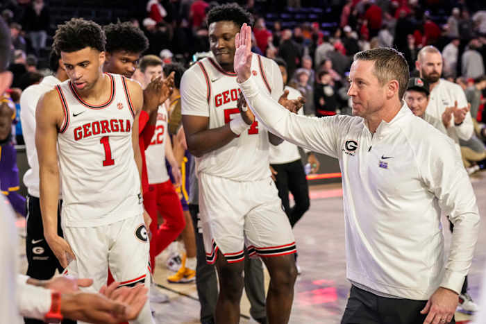 Jan 24, 2024; Athens, Georgia, USA; Georgia Bulldogs head coach Mike White (right) reacts with his players after defeating the LSU Tigers at Stegeman Coliseum. Mandatory Credit: Dale Zanine-USA TODAY Sports  
